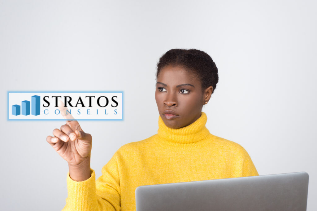 serious developer holding laptop touching virtual screen